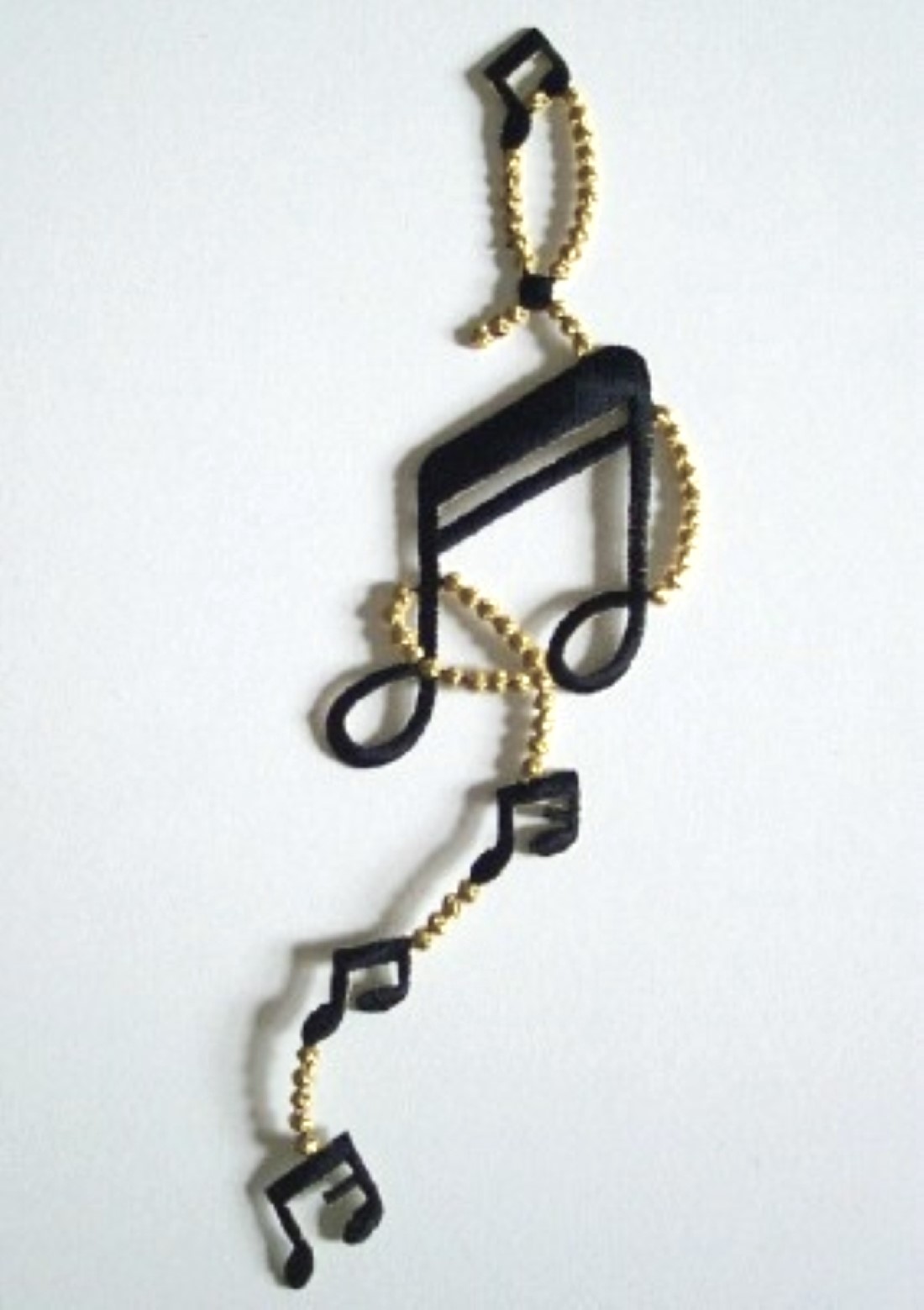 Gold/Black Notes Chain Applique