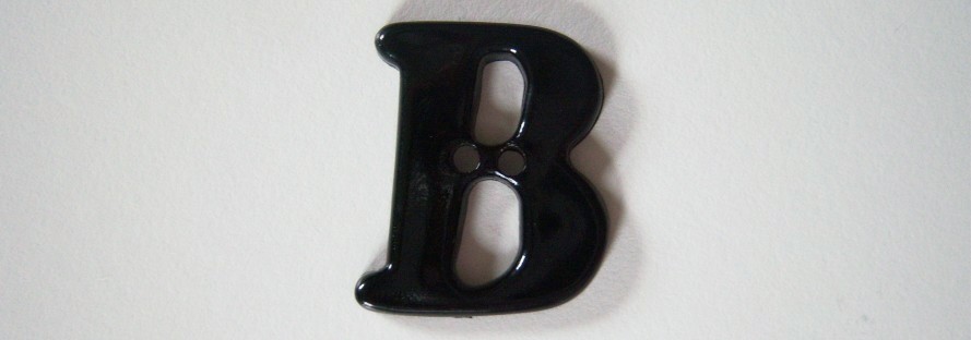Black letter В 1 1/8" with 2 holes poly button.