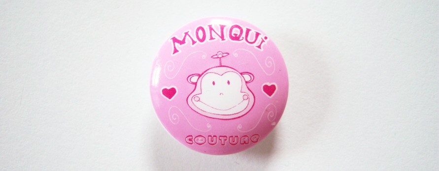Round pink and in red script Monqui Couture 15/16" with shank back poly button.