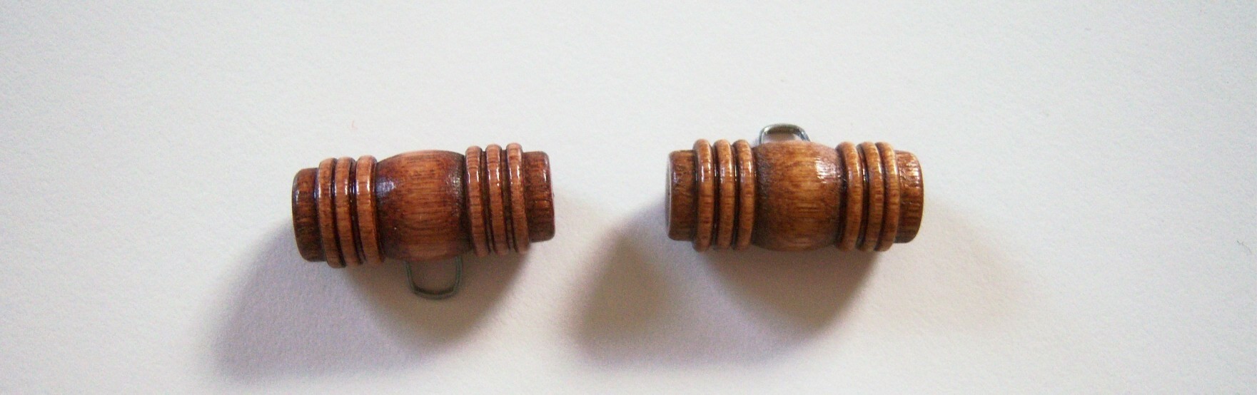 Walnut wood toggle button.