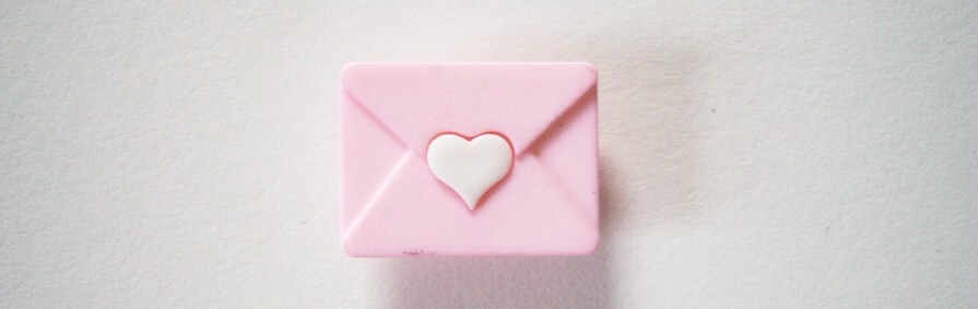JHB pink letter with white heart seal 5/8" x 3/4" with shank back nylon button.