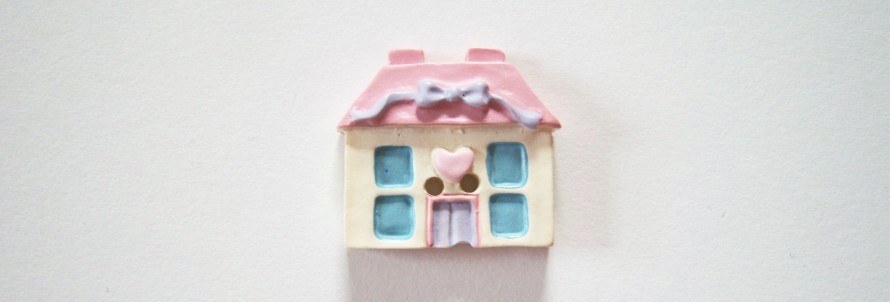 Ivory pink roof cottage with blue windows and door 7/8" 2 hole poly resin button.