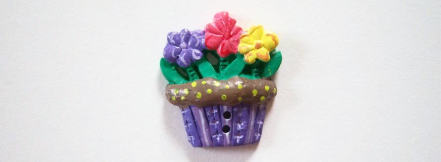 Purple flower pot dirt and 3 flowers in yellow red and purple with green leaves 1" with 2 holes clay button.