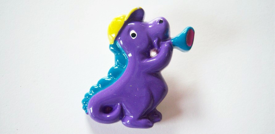 Purple dino/yellow cap turquoise horn and tail 1 1/4" x 1 5/8" shank back poly button.