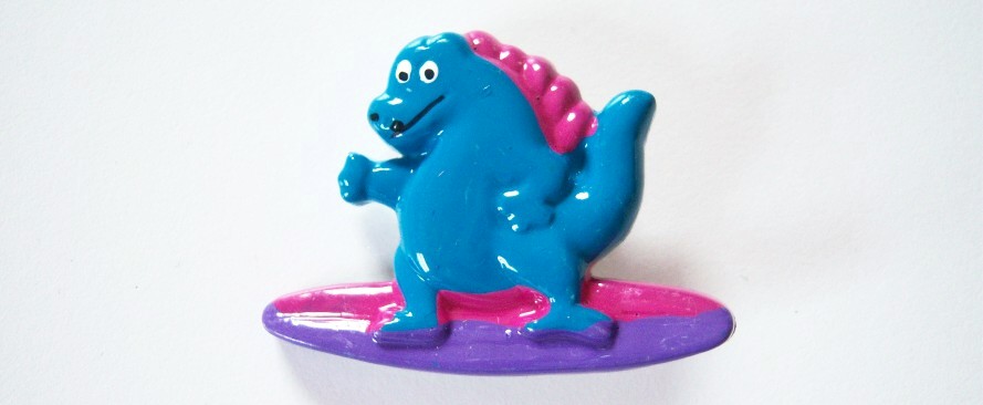 Turquoise dinosaur/pink and purple surfboard 1 1/2" x 2" shank back poly button.