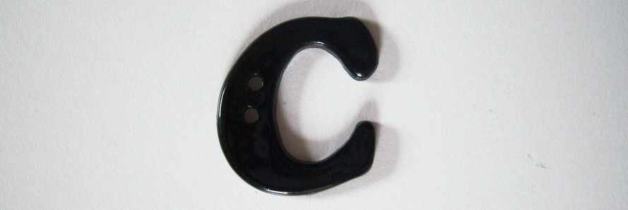 Black letter С 1 1/8" with 2 holes poly button.
