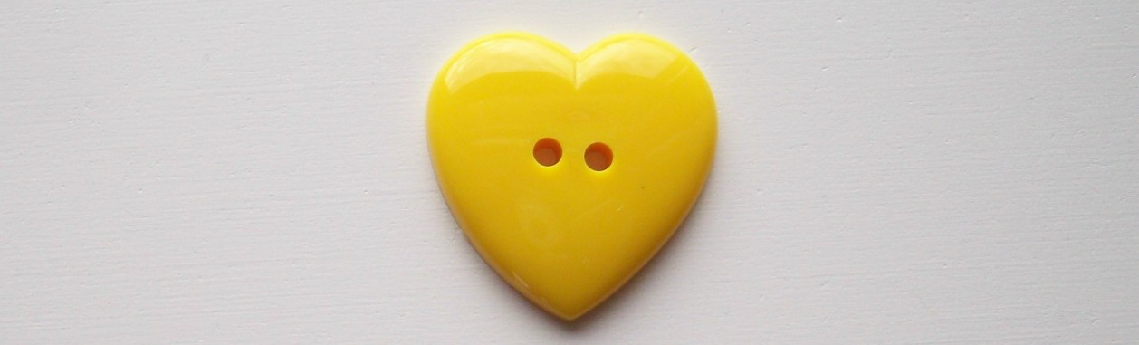 Yellow heart 1 3/16" 2 hole poly button.