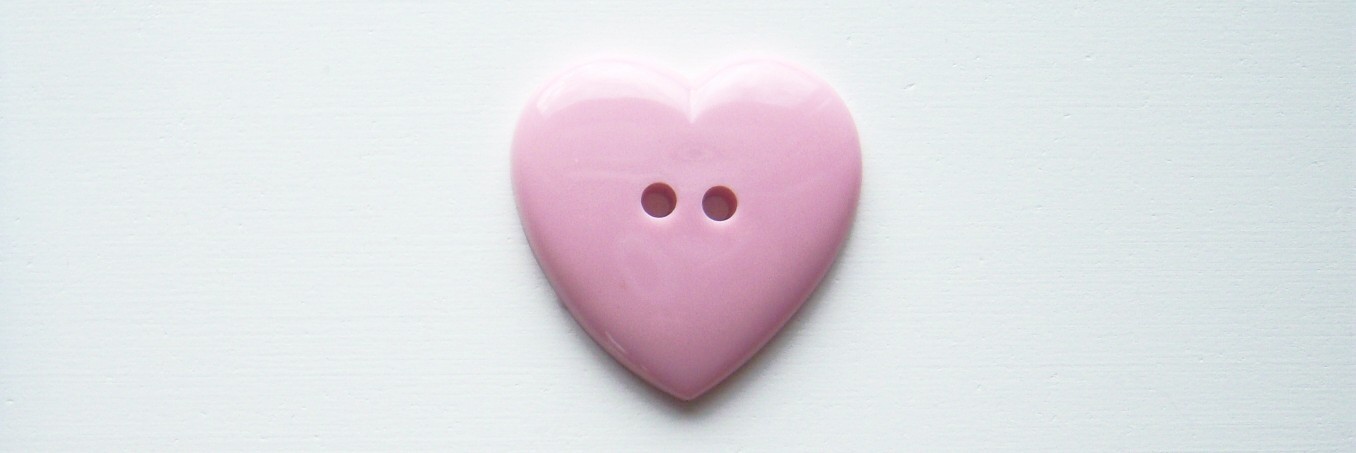 Pink heart 1 3/16" 2 hole poly button.