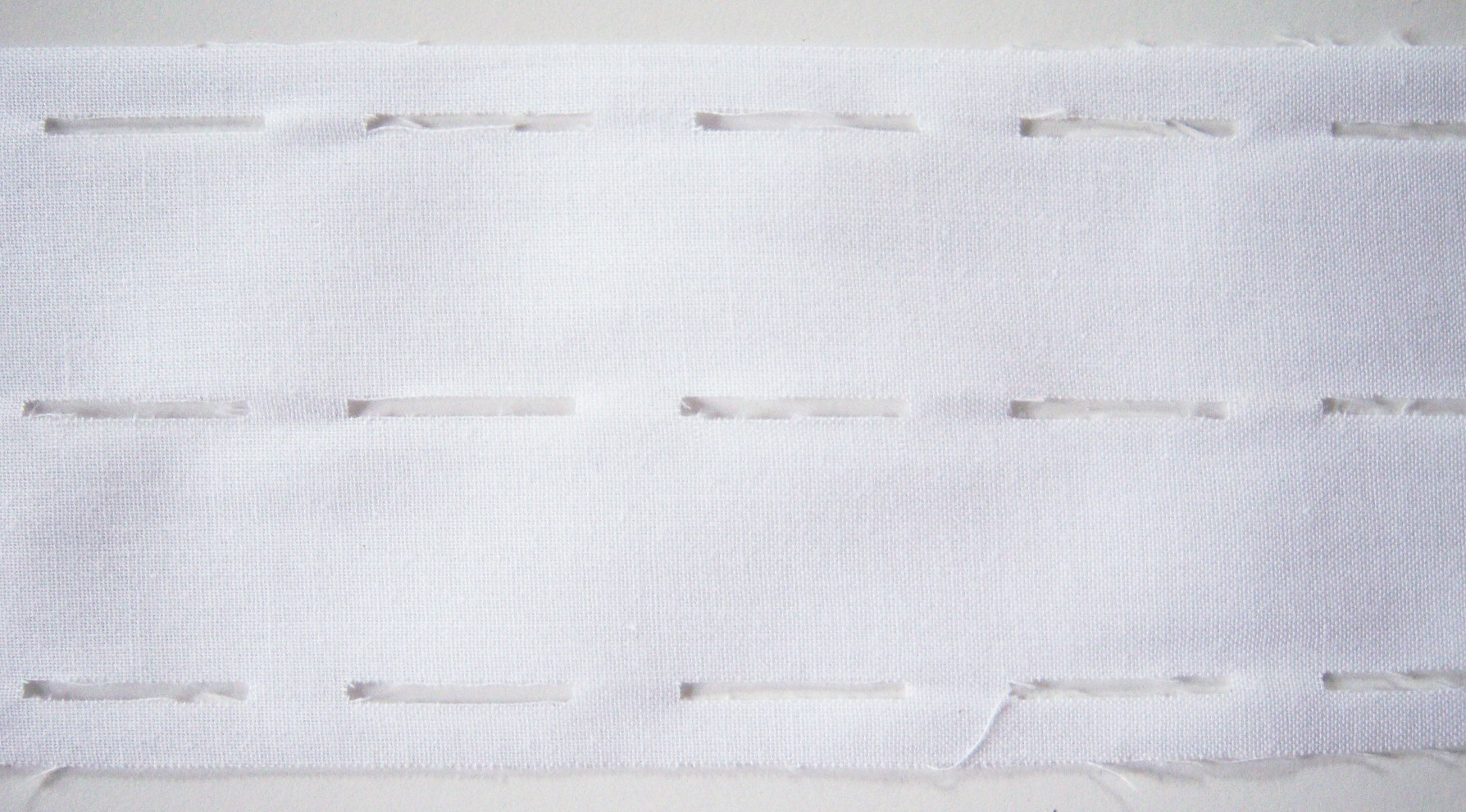 White Woven Perforated Fusible Interfacing
